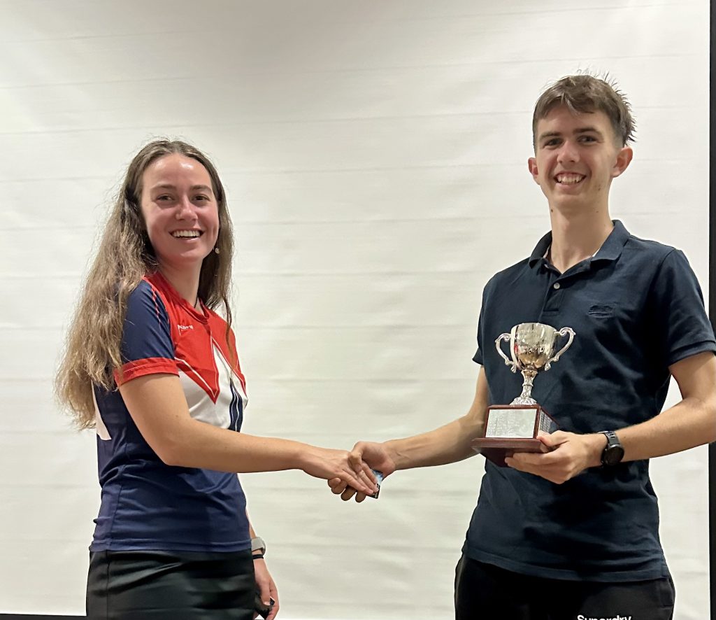 Mikaela Gray presenting Cooper Horley his NOL m20 winners trophy - Orienteering Australia