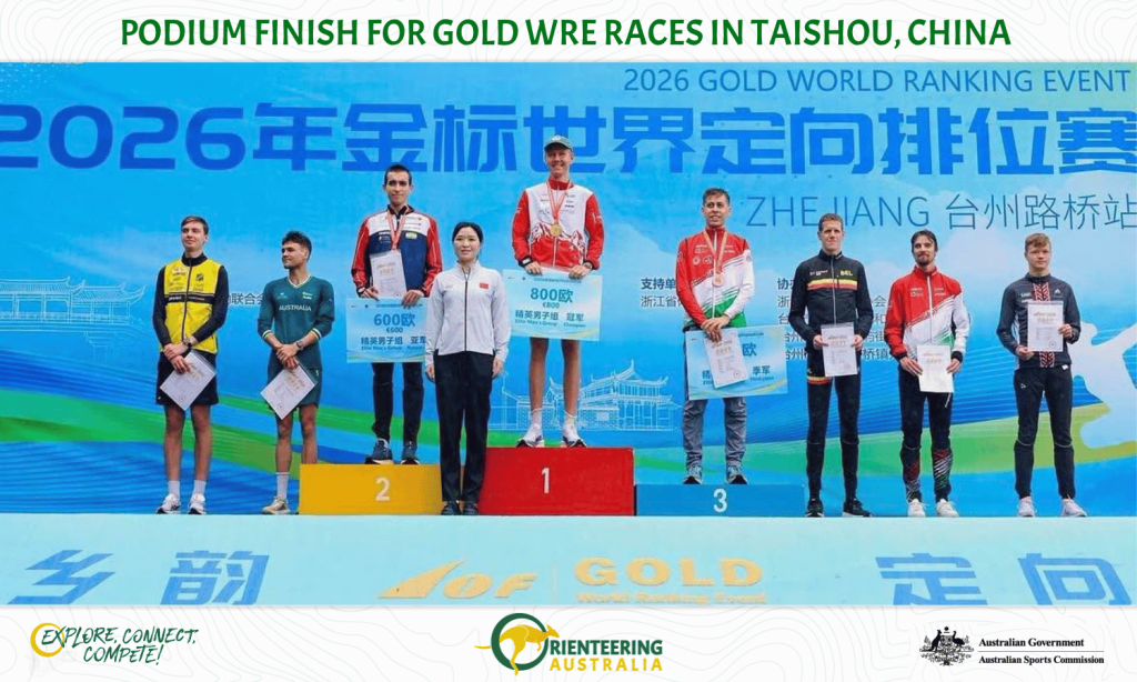 Podium ceremony at 2026 Gold World Ranking Event in Taishou, China: athletes on 1st, 2nd and 3rd place stands receiving certificates, with a blue banner behind.